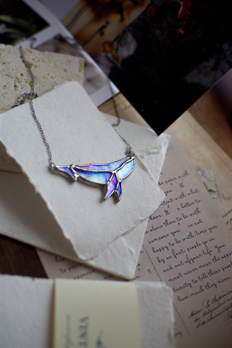 Iridescent whale necklace