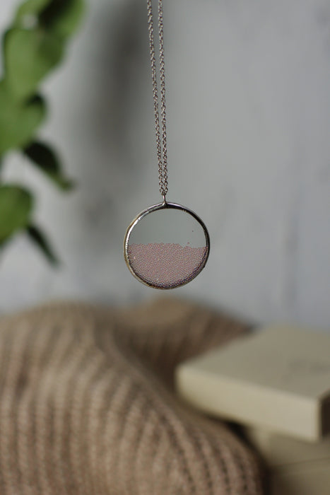 Pink ball perpetual motion necklace