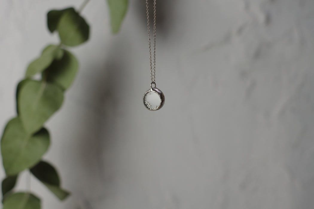 Small perpetual motion necklace with silver balls